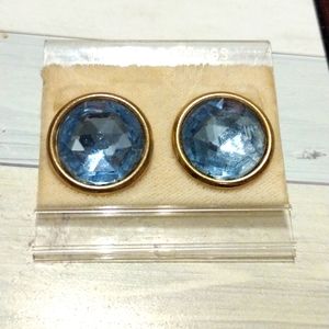 Goldstone earrings with blue topaz colored middle ,about the size of a nickel.